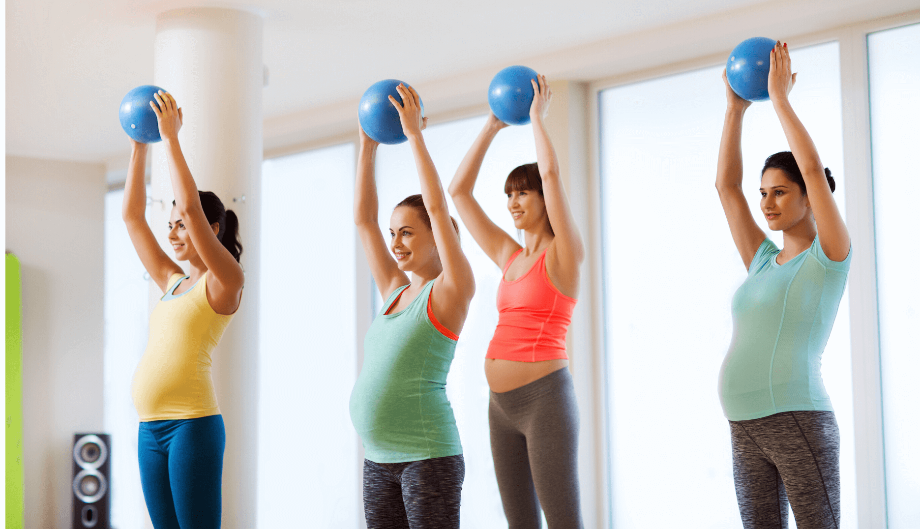 female yoga class with yoga balls